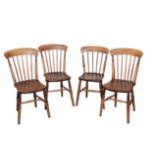 AN ASSOCIATED SET OF FOUR VICTORIAN ELM AND BEECH SPINDLE BACK KITCHEN CHAIRS,