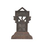 A VICTORIAN AESTHETIC MOVEMENT CAST IRON DOOR PORTER, IN THE MANNER OF THOMAS JECKYLL,