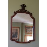 A REGENCY WALNUT FRAMED WALL MIRROR,