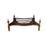 A WROUGHT IRON, CAST IRON AND BRASS MOUNTED FIREGRATE IN GEORGE III STYLE,