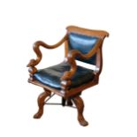 A MAHOGANY REVOLVING ELBOW CHAIR, PROBABLY ITALIAN,