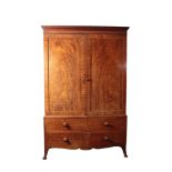 A LATE GEORGE III MAHOGANY LINEN PRESS,