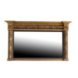 A REGENCY GILTWOOD AND COMPOSITION FRAMED OVERMANTEL MIRROR,