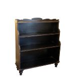 A GEORGE IV EBONISED WOOD WATERFALL BOOKCASE,