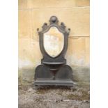 A LATE VICTORIAN OR EDWARDIAN PAINTED CAST IRON FRAMED WALL MIRROR,