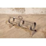 A GEORGE III WROUGHT IRON PIPE WARMER,