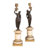 A PAIR OF LOUIS PHILIPPE PATINATED AND GILT BRONZE FIGURAL CANDLE HOLDERS,