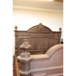 A SUBSTANTIAL CARVED OAK BED,