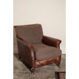 A VICTORIAN LEATHER UPHOLSTERED ARMCHAIR,