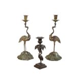 A PAIR OF GEORGE IV OR WILLIAM IV BRONZE CANDLE HOLDERS CAST WITH STORKS, PROBABLY BY THOMAS...