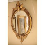 A VICTORIAN GILT COMPOSITION FRAMED PTERIDOMANIA OVAL WALL MIRROR,