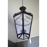 A PAINTED METAL AND GLAZED CEILING LANTERN,