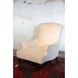 A VICTORIAN UPHOLSTERED ARMCHAIR, IN THE MANNER OF HOWARD AND SONS,