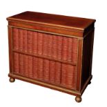 A REGENCY MAHOGANY AND PARCEL GILT DOUBLE-SIDED OPEN BOOKCASE, IN THE MANNER OF HOLLAND & SONS,