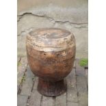 AN AFRICAN CARVED HARDWOOD DRUM,