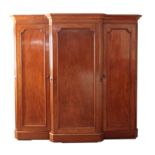 AN EARLY VICTORIAN MAHOGANY BREAKFRONT WARDROBE, POSSIBLY BY HOLLAND & SONS,