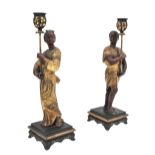 A PAIR OF CONTINENTAL PAINTED METAL FIGURAL CANDLEHOLDERS,