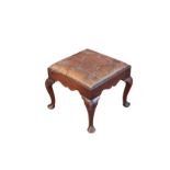 A GEORGE II MAHOGANY AND BUTTONED LEATHER UPHOLSTERED STOOL,