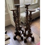 TWO PAIRS OF CONTINENTAL CARVED AND GILTWOOD ALTAR STICKS,