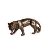 AN ORIENTAL PATINATED METAL MODEL OF A TIGER,