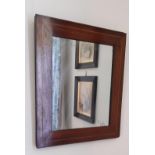 A WALNUT FRAMED RECTANGULAR WALL MIRROR,