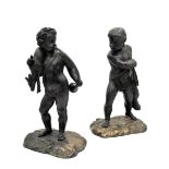A PAIR OF CONTINENTAL PATINATED BRONZE MODELS OF PUTTI,
