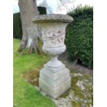 AN IMPRESSIVE CARVED LIMESTONE GARDEN URN ON PLINTH,