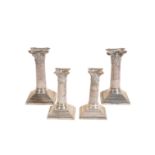 A PAIR OF SILVER CORINTHIAN COLUMN CANDLESTICKS