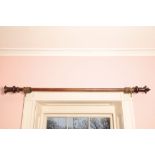 A GEORGE IV MAHOGANY CURTAIN POLE,