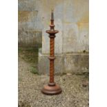 A VICTORIAN OAK LAMP STAND,