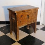 A STAINED PINE COFFER STOOL,