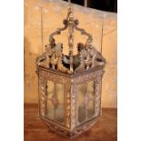 A CAST AND REPOUSSE BRASS HALL LANTERN,