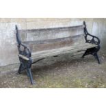 A CAST IRON AND SLATTED WOOD GARDEN BENCH,