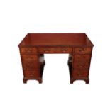 A MAHOGANY AND LEATHER INSET PEDESTAL DESK, IN GEORGE III STYLE,