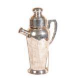 A SILVER COCKTAIL SHAKER,