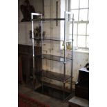 A SET OF CHROMIUM PLATED AND SMOKED GLASS OPEN SHELVES,