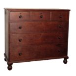 AN OAK CHEST OF DRAWERS, BY GILLOWS,