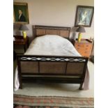 A STAINED HARDWOOD AND CANEWORK DOUBLE BED, BY HEAL & CO.,