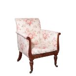 A REGENCY MAHOGANY AND UPHOLSTERED LIBRARY ARMCHAIR,