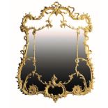 A GEORGE III CARVED GILTWOOD WALL MIRROR, IN THE MANNER OF MATTHIAS LOCK,