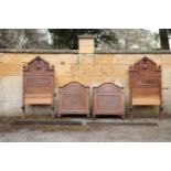 A PAIR OF ITALIAN WALNUT AND BURR WALNUT SINGLE BEDS,