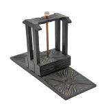 AN ANGLO INDIAN CARVED EBONY FLOWER PRESS,