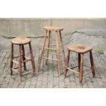 THREE VARIOUS ENGLISH ELM, OAK AND BEECH STOOLS,