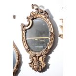 AN EARLY VICTORIAN GILTWOOD AND COMPOSITION FRAMED WALL MIRROR IN ROCOCO REVIVAL STYLE,
