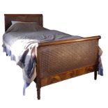 A MAHOGANY AND CANEWORK BED, BY HEAL & SON,