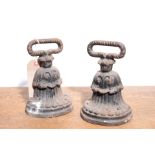 A PAIR OF REGENCY CAST IRON DOOR PORTERS,