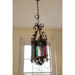 A WROUGHT IRON AND GLAZED HALL LANTERN, IN GOTHIC STYLE,