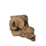 A STONEWARE POSSIBLY COADESTONE ARCHITECTURAL FRAGMENT MODELLED WITH A COILED DOLPHIN,