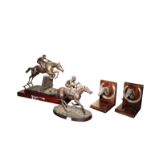 A PATINATED METAL GROUP OF A RACEHORSE AND JOCKEY,