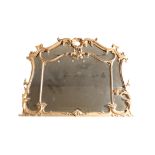 A CARVED AND GILTWOOD MARGINAL MANTEL MIRROR, IN ROCOCO REVIVAL STYLE,